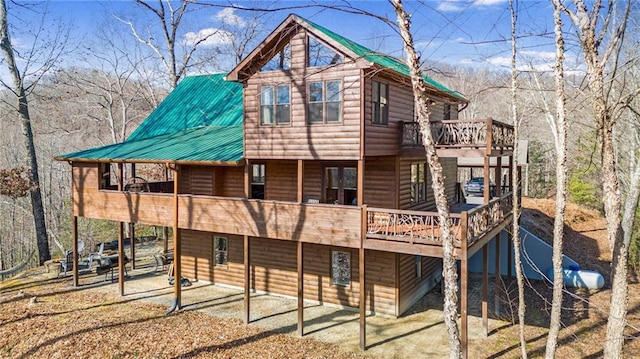 rear view of property with a deck