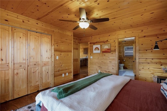 bedroom with wood walls, wood ceiling, ensuite bath, wood-type flooring, and ceiling fan