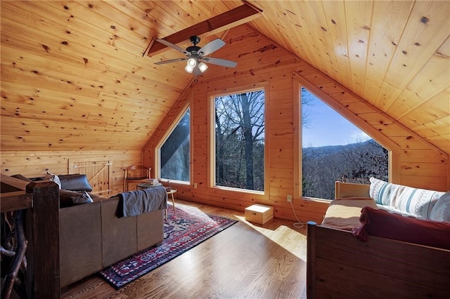 interior space featuring hardwood / wood-style floors, vaulted ceiling with beams, and wooden ceiling