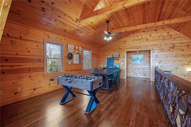 playroom featuring wood ceiling, wood walls, dark hardwood / wood-style flooring, and vaulted ceiling with beams