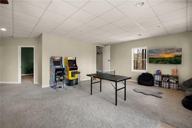 playroom featuring a paneled ceiling and carpet