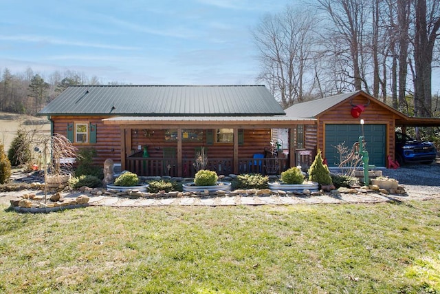 view of front facade with a garage, a front yard, and covered porch