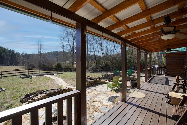 wooden terrace featuring ceiling fan