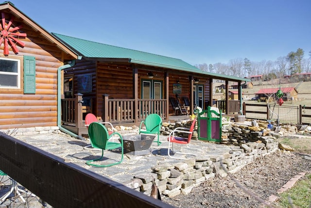 exterior space with a patio and an outdoor fire pit