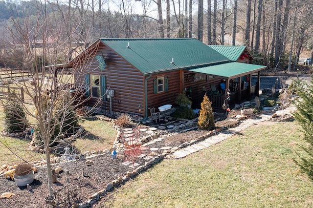 view of side of home featuring a lawn