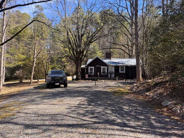 view of street featuring gravel driveway