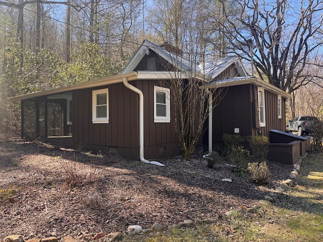 view of home's exterior featuring crawl space and board and batten siding