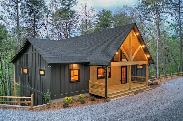 84 Grant Ln, Mineral Bluff, GA 30559 - view of front of house with a shingled roof, board and batten siding, and a porch