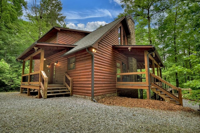 4527 Gates Chapel Rd, Ellijay, GA 30540 - view of side of home featuring roof with shingles, log veneer siding, stairs, a wooden deck, and a chimney