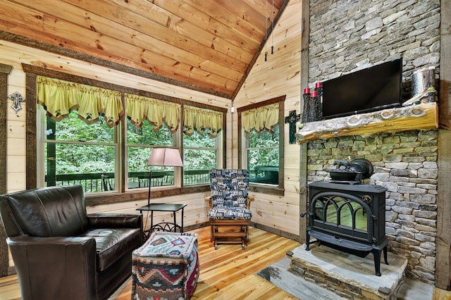 4527 Gates Chapel Rd, Ellijay, GA 30540 - living area featuring a wood stove, healthy amount of natural light, hardwood / wood-style floors, vaulted ceiling, and wooden ceiling