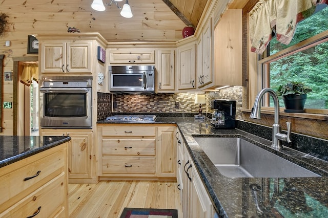 4527 Gates Chapel Rd, Ellijay, GA 30540 - kitchen with appliances with stainless steel finishes, light brown cabinetry, light wood-type flooring, wood ceiling, and backsplash