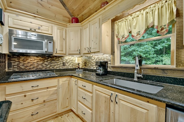 4527 Gates Chapel Rd, Ellijay, GA 30540 - kitchen featuring appliances with stainless steel finishes, vaulted ceiling, wooden ceiling, tasteful backsplash, and dark stone counters