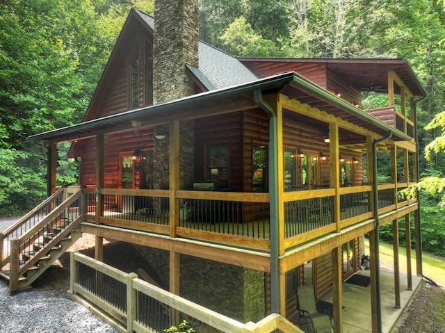 4527 Gates Chapel Rd, Ellijay, GA 30540 - view of side of home with a chimney, log veneer siding, stairway, and roof with shingles