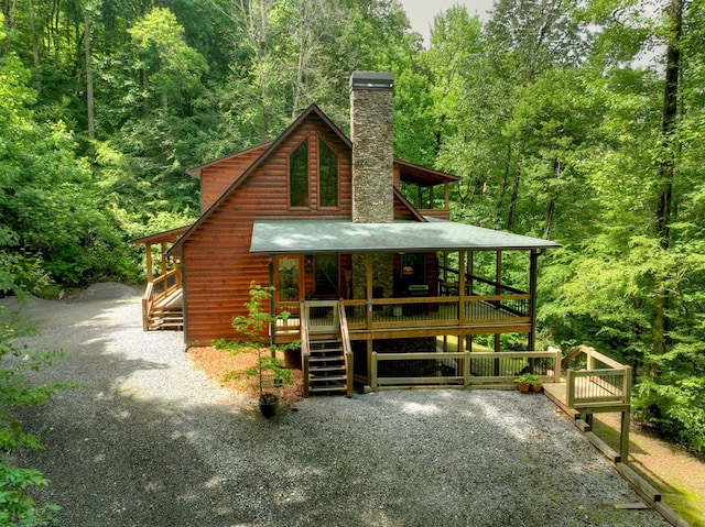 4527 Gates Chapel Rd, Ellijay, GA 30540 - view of front facade featuring a chimney, a forest view, covered porch, and stairs