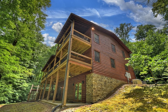 4527 Gates Chapel Rd, Ellijay, GA 30540 - view of property exterior featuring log veneer siding, stairs, stone siding, a deck, and a balcony