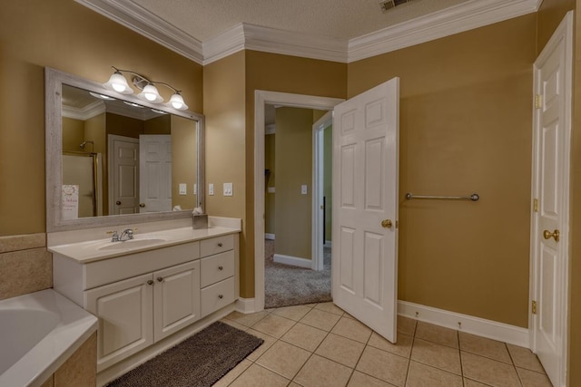 bathroom featuring tile patterned floors, vanity, a textured ceiling, and ornamental molding