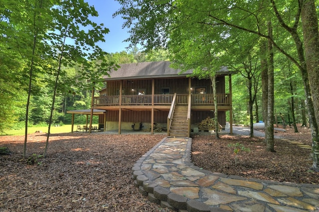 4525 Gates Chapel Rd, Ellijay, GA 30540 - back of property featuring stairs, a deck, board and batten siding, and a shingled roof