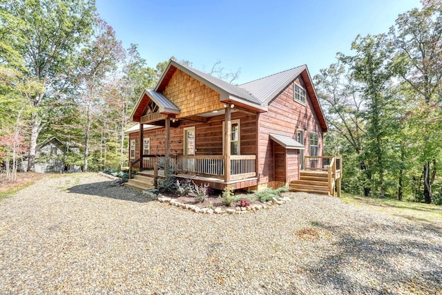 view of property exterior featuring covered porch