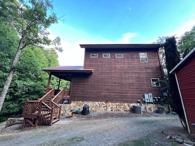 view of home's exterior featuring central air condition unit