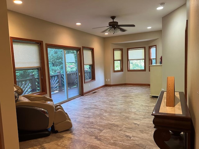 doorway to outside with ceiling fan