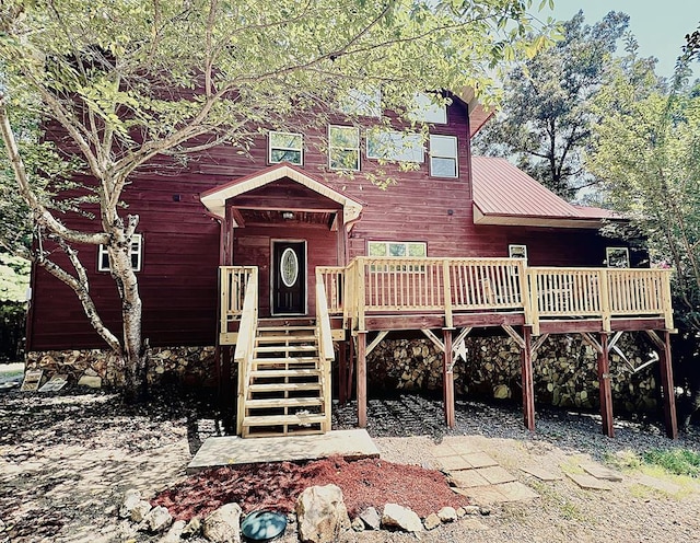 view of front of property with a wooden deck