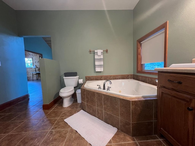 bathroom with a relaxing tiled tub and toilet