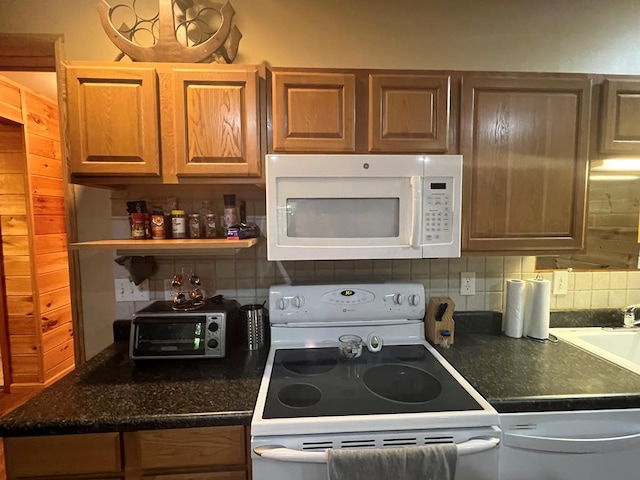 kitchen with decorative backsplash and white appliances