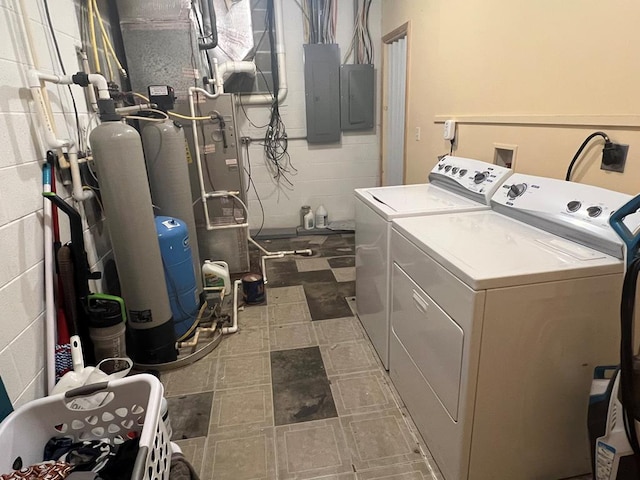 laundry room featuring washing machine and dryer and electric panel