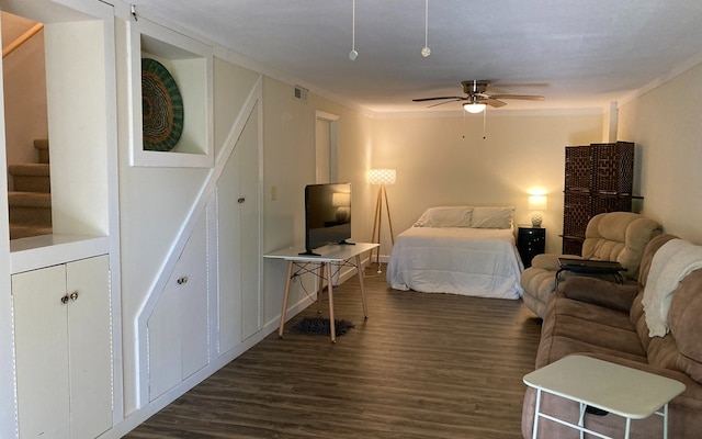 bedroom featuring ceiling fan and dark wood-type flooring