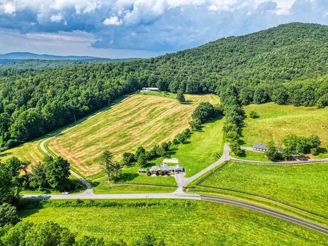 drone / aerial view featuring a forest view