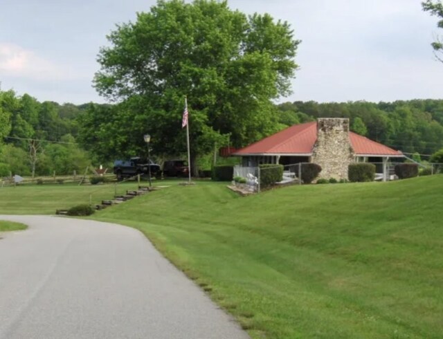 view of home's community featuring a yard