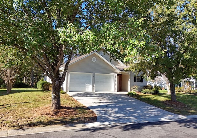 view of front of home with a garage and a front lawn