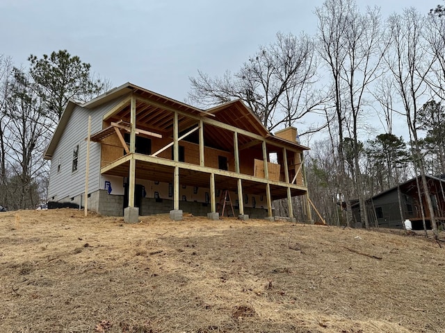 back of property featuring a balcony