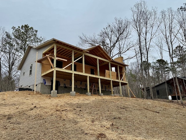 rear view of house with a balcony