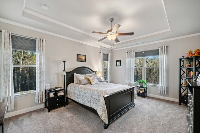 9475 Dunmoore Dr, Cumming, GA 30028 - bedroom with a raised ceiling, multiple windows, baseboards, and light carpet
