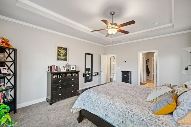 9475 Dunmoore Dr, Cumming, GA 30028 - bedroom with baseboards, a raised ceiling, arched walkways, and light colored carpet