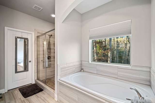9475 Dunmoore Dr, Cumming, GA 30028 - full bathroom featuring a shower stall, a bath, and visible vents