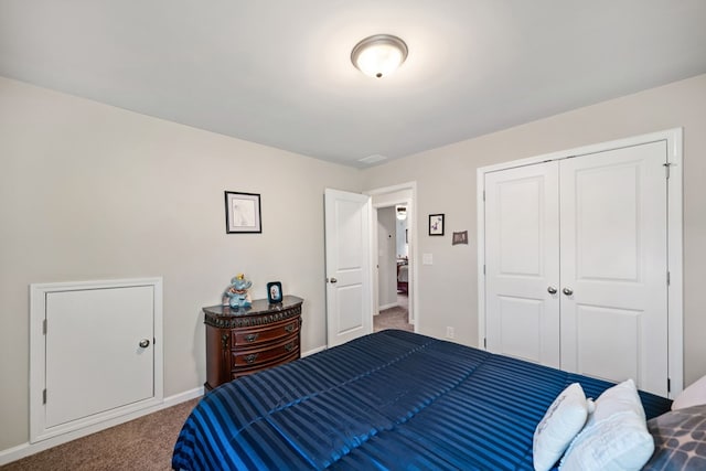 9475 Dunmoore Dr, Cumming, GA 30028 - bedroom with a closet, baseboards, and carpet