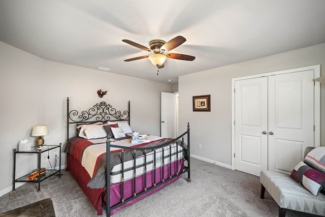 9475 Dunmoore Dr, Cumming, GA 30028 - carpeted bedroom featuring a closet, ceiling fan, and baseboards