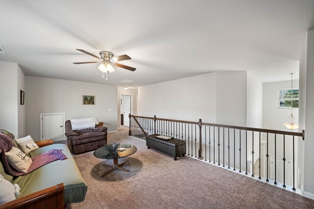 9475 Dunmoore Dr, Cumming, GA 30028 - living area with visible vents, carpet floors, and ceiling fan