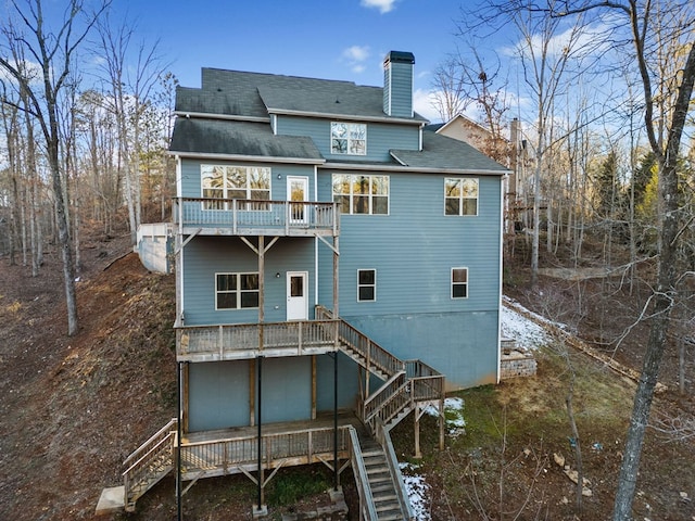 9475 Dunmoore Dr, Cumming, GA 30028 - rear view of property with a chimney and stairs