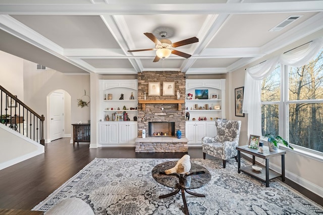 9475 Dunmoore Dr, Cumming, GA 30028 - living room with visible vents, dark wood finished floors, a fireplace, arched walkways, and coffered ceiling