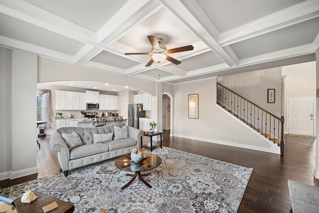9475 Dunmoore Dr, Cumming, GA 30028 - living area featuring arched walkways, coffered ceiling, stairs, and dark wood-type flooring