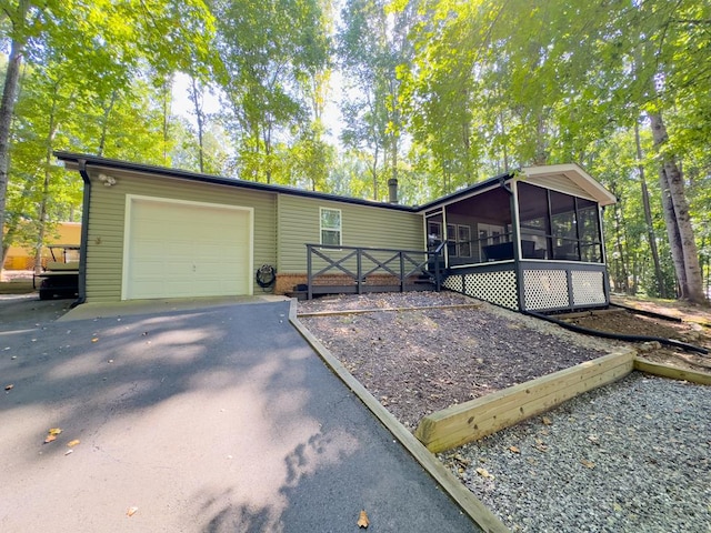 view of front of property with a sunroom