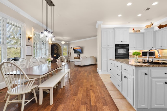 270 Milford Trl, Talking Rock, GA 30175 - dining space featuring light wood-style flooring, visible vents, crown molding, and ceiling fan