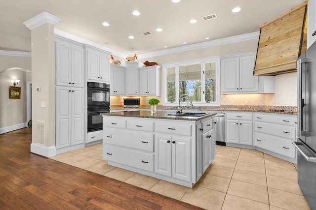 270 Milford Trl, Talking Rock, GA 30175 - kitchen with arched walkways, dobule oven black, a sink, ornamental molding, and stainless steel dishwasher
