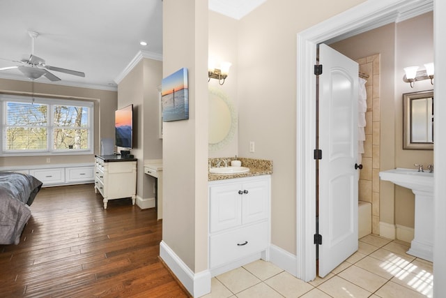 270 Milford Trl, Talking Rock, GA 30175 - bathroom featuring a ceiling fan, ornamental molding, wood finished floors, a sink, and baseboards