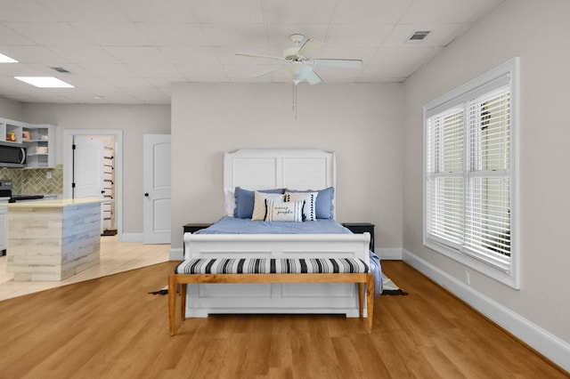 270 Milford Trl, Talking Rock, GA 30175 - bedroom featuring baseboards, light wood-style flooring, a ceiling fan, visible vents, and a drop ceiling