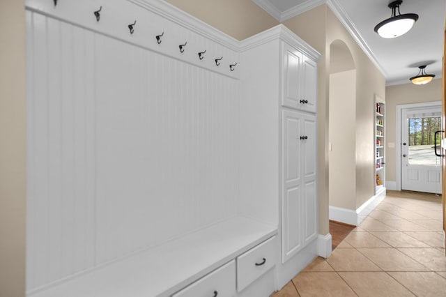 270 Milford Trl, Talking Rock, GA 30175 - mudroom featuring arched walkways, light tile patterned floors, baseboards, and crown molding