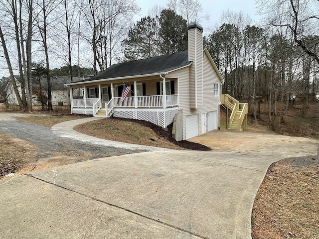 view of front facade with a porch and a garage